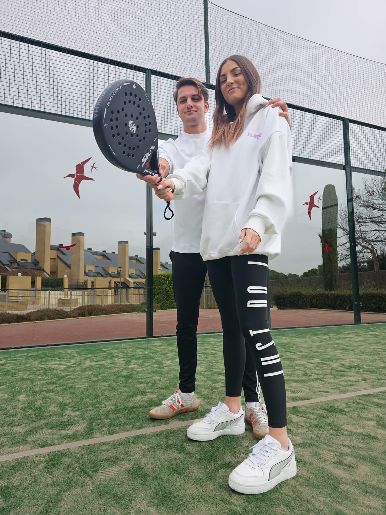 Pareja de jugadores en pista